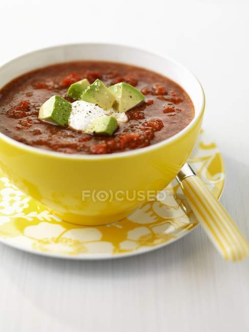 Gazpacho with avocado in bowl — Stock Photo
