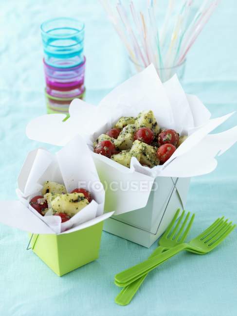 Potato salad with cherry tomatoes in a take-away boxes — Stock Photo