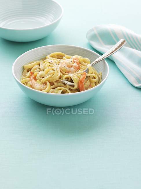 Ribbon pasta with prawns — Stock Photo