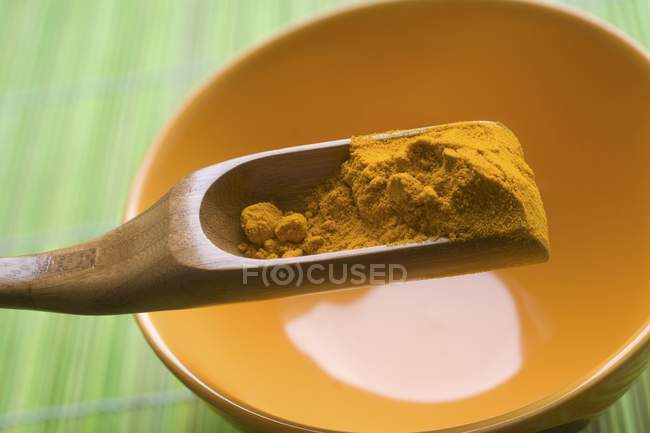 Turmeric powder scoop — Stock Photo