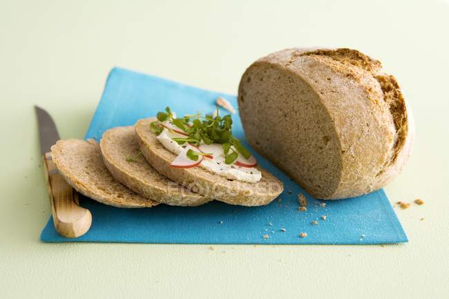 Bread topped with radishes — Stock Photo