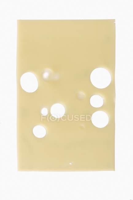 Slice of Emmental cheese — Stock Photo