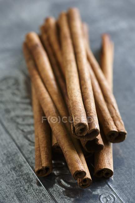 Cinnamon sticks on blue background — Stock Photo