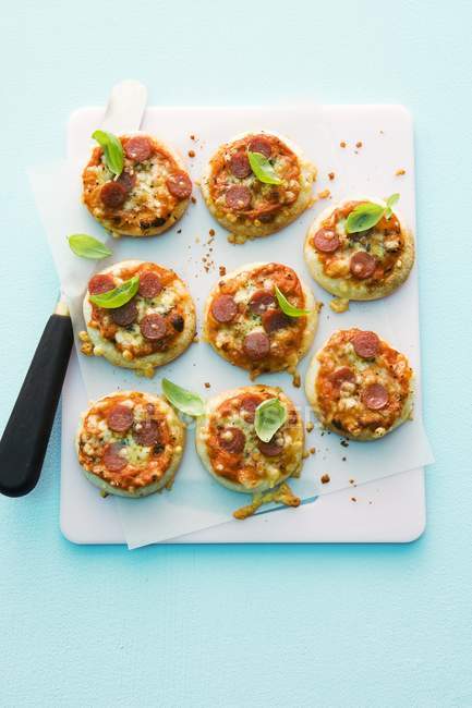 Mini-pizzas with salami — Stock Photo