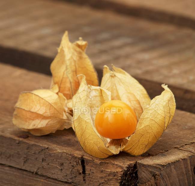 Physalis on wooden board — Stock Photo