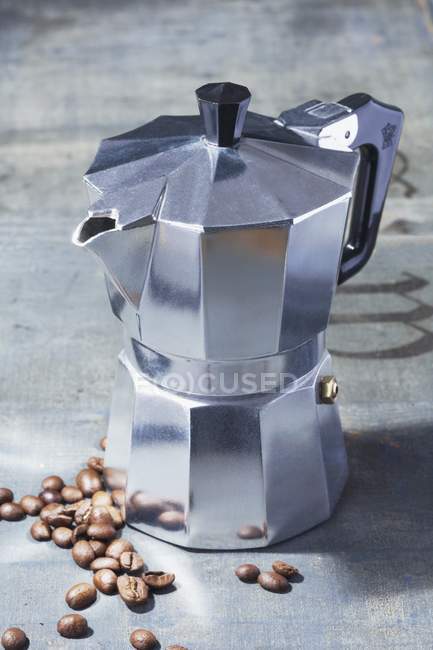 Closeup view of vintage Espresso machine with coffee beans — Stock Photo