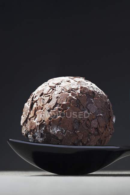 Closeup view of rum truffle on spoon — Stock Photo