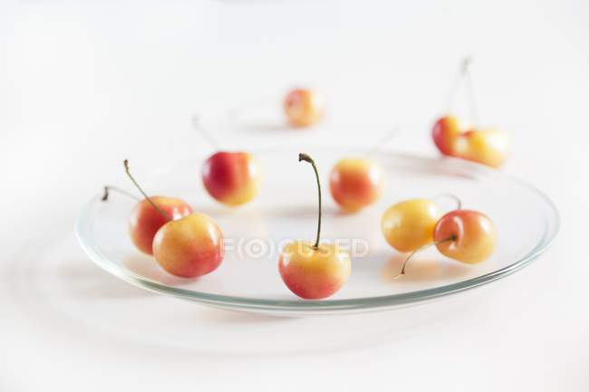 Rainier Cherries on Glass Plate — Stock Photo