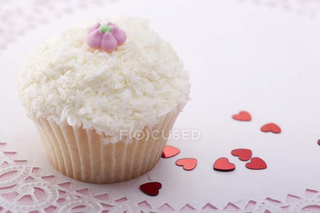 Cupcake with grated coconut — Stock Photo