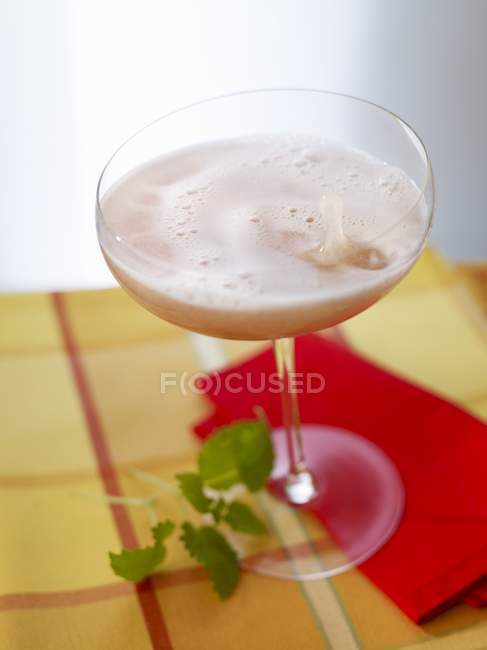 Champagne cocktail with cherry — Stock Photo
