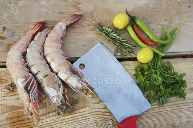 Jumbo shrimp and chili peppers — Stock Photo