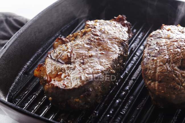 Steaks Cooking in Grill — Stock Photo