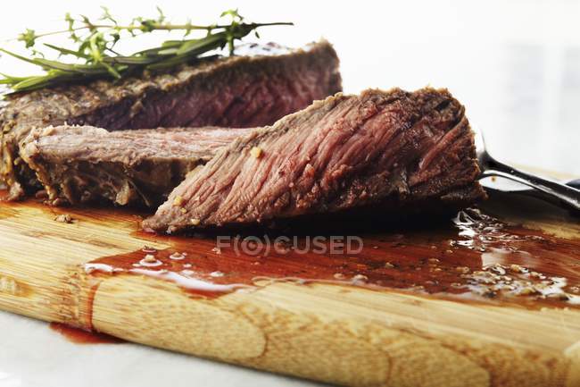 Sliced Steak on board — Stock Photo