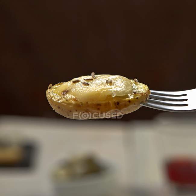 Potato with melted cheese — Stock Photo