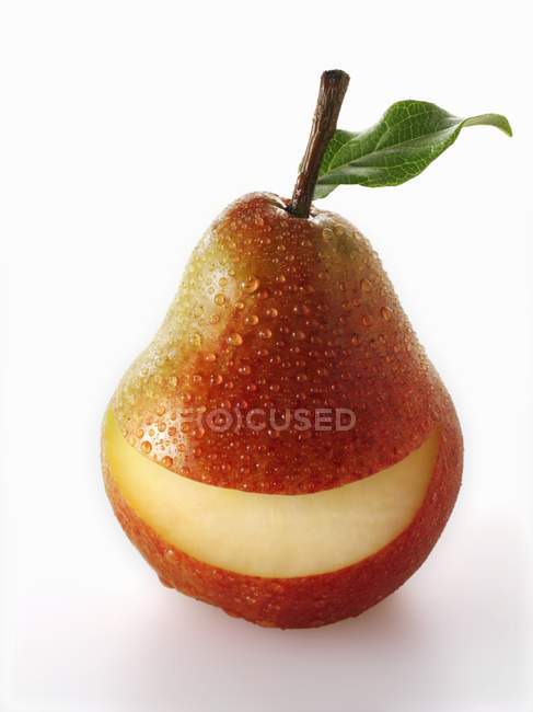 Red pear with slice — Stock Photo