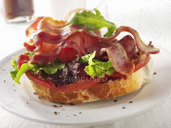 Slice of baguette  with bacon — Stock Photo