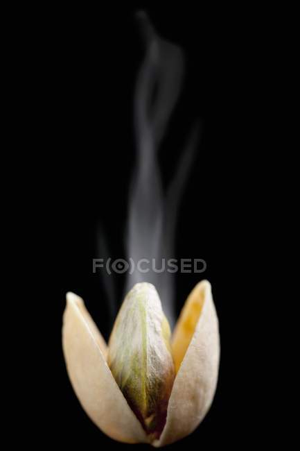 Steaming opened toasted pistachio — Stock Photo