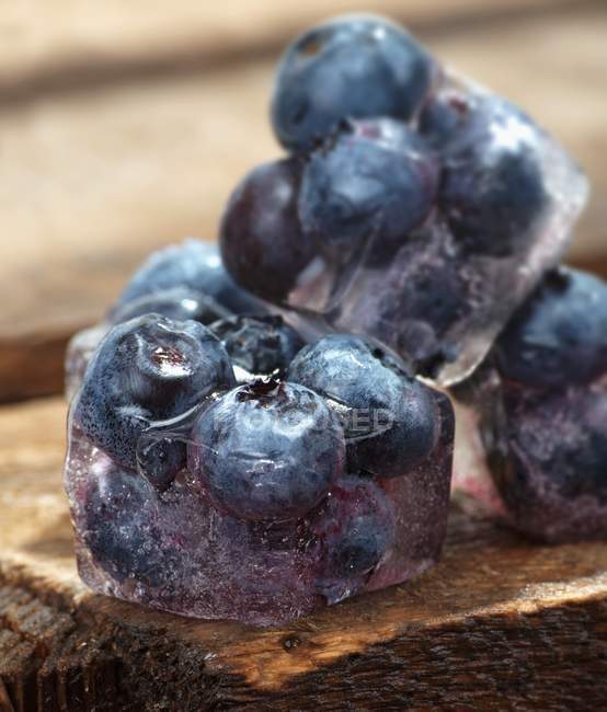 Ice cubes with blueberries — Stock Photo