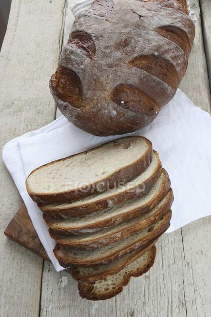 Rustic bread baked — Stock Photo
