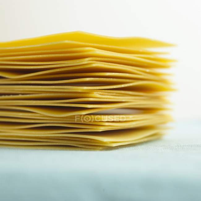 Stack of raw lasagne sheets — Stock Photo
