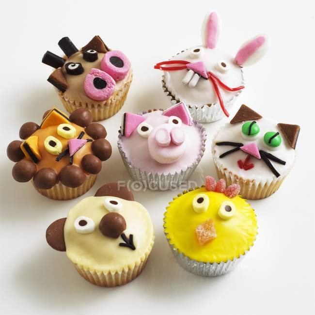 Cupcakes decorated with animal faces — Stock Photo