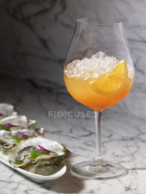 Closeup view of Venetian Spritz with oysters on shell halves — Stock Photo