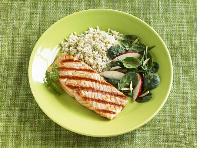 Grilled salmon with rice and spinach — Stock Photo