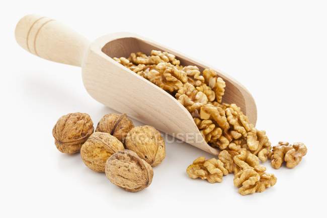 Walnuts on wooden scoop — Stock Photo