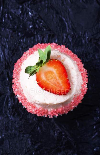 Cupcake decorated with strawberry — Stock Photo