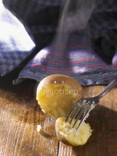 Baked partly eaten potato — Stock Photo