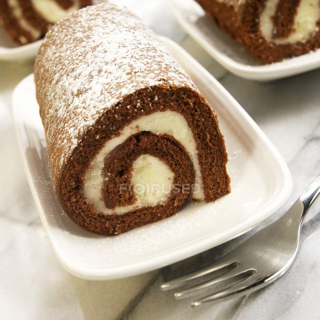 Individual Cream Filled Pumpkin Roll Dusted with Powdered Sugar — Stock Photo