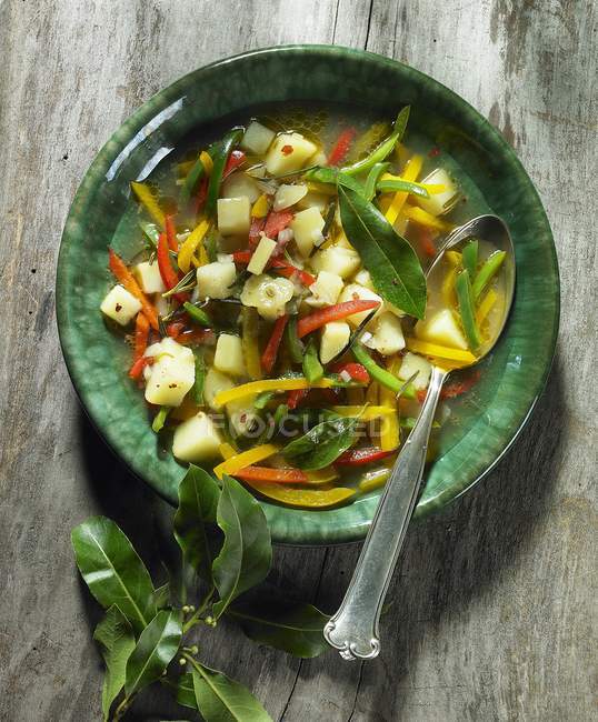 Potato and pepper soup with bay leaves — Stock Photo