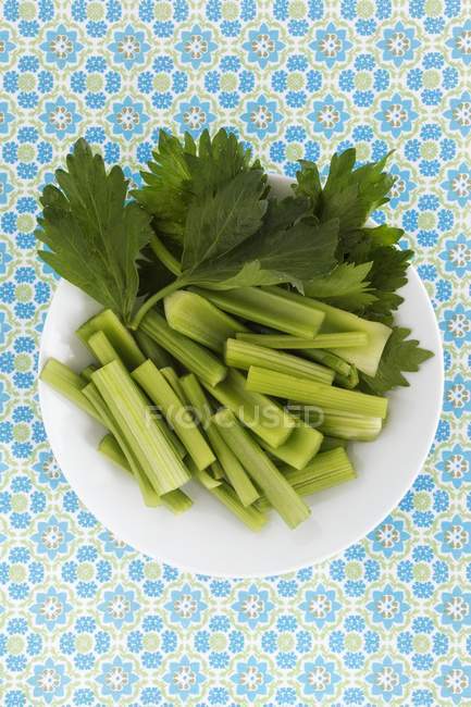 Plate of fresh sliced celery — Stock Photo