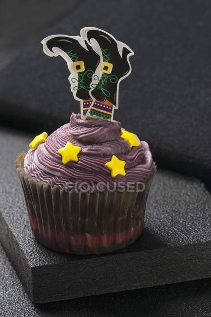 Cupcake decorated with witch — Stock Photo