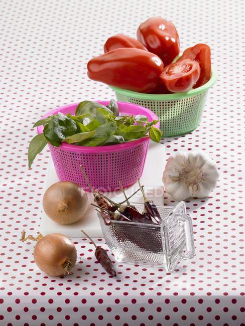 Ingredients for tomato ragout on table with cloth — Stock Photo