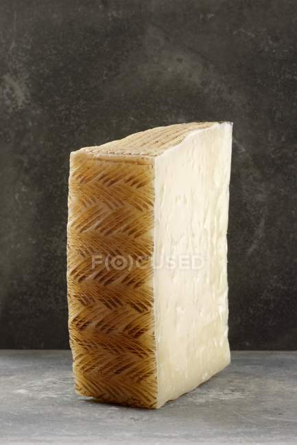 Slice of Manchego cheese — Stock Photo