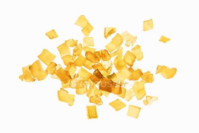 Closeup top view of candied orange peels on white background — Stock Photo