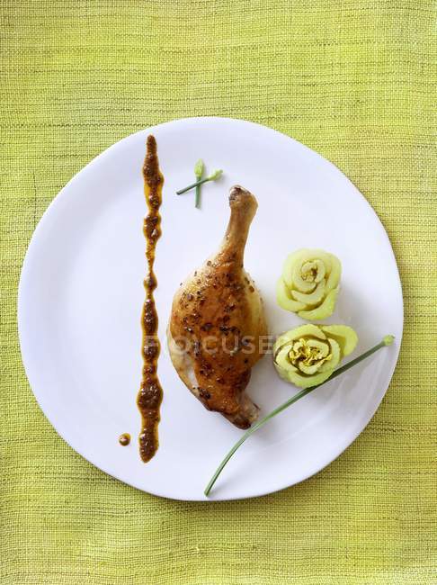 Duck Drumstick with Celery Flowers — Stock Photo