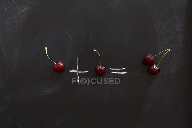 One Cherry plus one cherry — Stock Photo