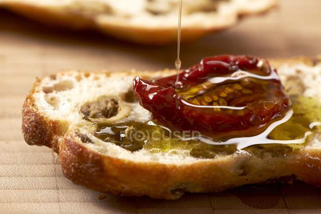 Tried tomatoes with oil — Stock Photo