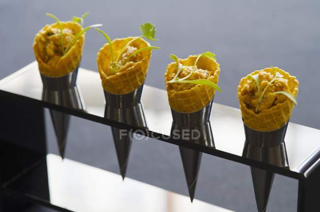 Ice cream cones filled with coronation chicken — Stock Photo