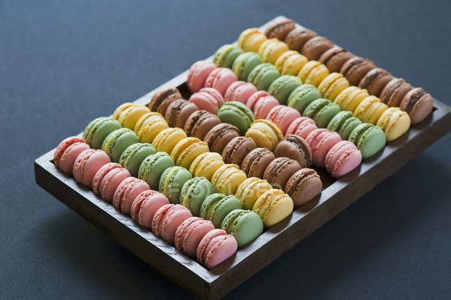 Macaroons in wooden box — Stock Photo