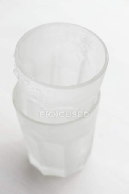 Closeup view of two stacked chilled glasses — Stock Photo