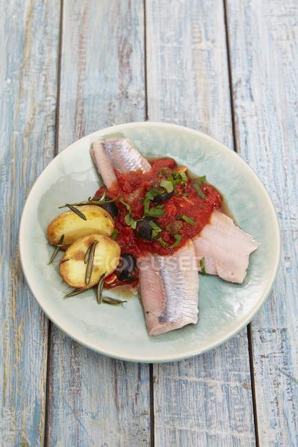 Soused herring fillets with tomato sauce — Stock Photo