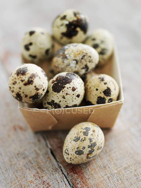 Quail eggs in box — Stock Photo