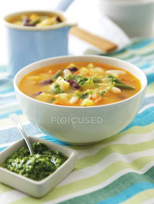 Vegetable soup with basil pesto — Stock Photo