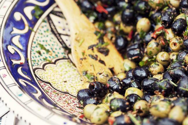 Marinated green and black olives — Stock Photo