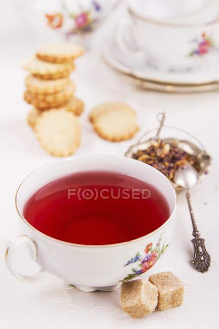 Floral tea with biscuits — Stock Photo