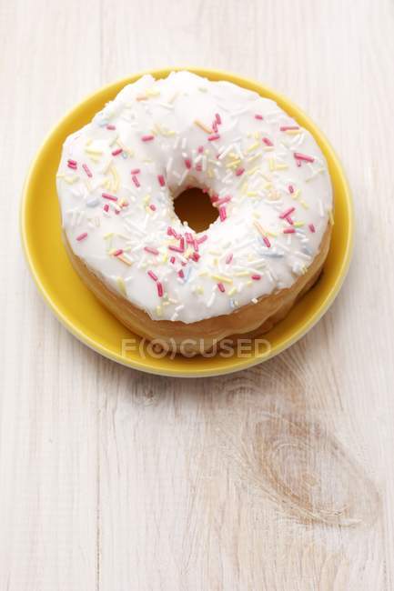 Iced doughnut with sugar sprinkles — Stock Photo