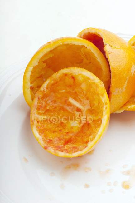 Juiced halves of oranges — Stock Photo